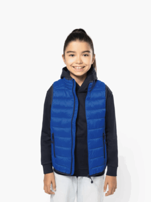 Doudoune sans manches K6115 pour enfant, légère, chaude et confortable. I déale pour les activités extérieures et entièrement personnalisable.